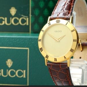 Vintage Gucci 3000.2.M Gold Dial Quartz
Men's Watch